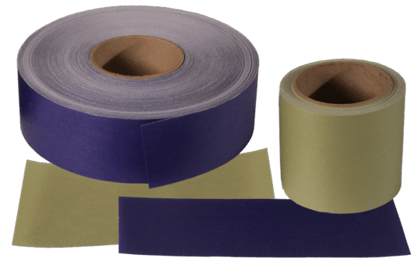 Two large rolls of sandpaper and two flat sheets in purple and yellow-green