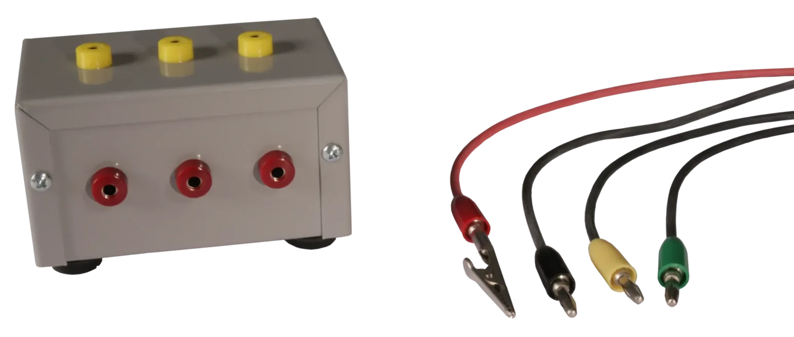 A gray electronics enclosure with yellow top posts and red front jacks, accompanied by four patch cables with alligator and banana plugs