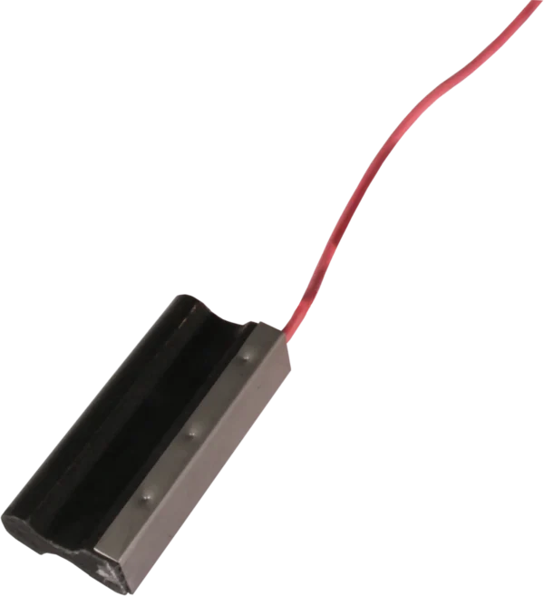 Carbon brush with an attached red wire against a black background